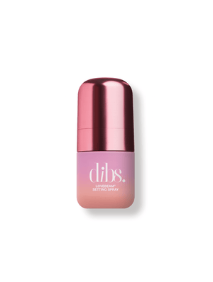 Pink bottle of mini 'dibs' setting spray on a white background
