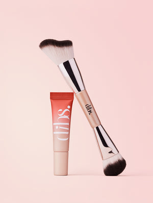 Duo Cheek Brush and Cool Blush Cheek Stain tube with 'dibs' branding on a pink background