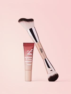Duo Cheek Brush and Cool Blush Cheek Stain tube with 'dibs' branding on a pink background